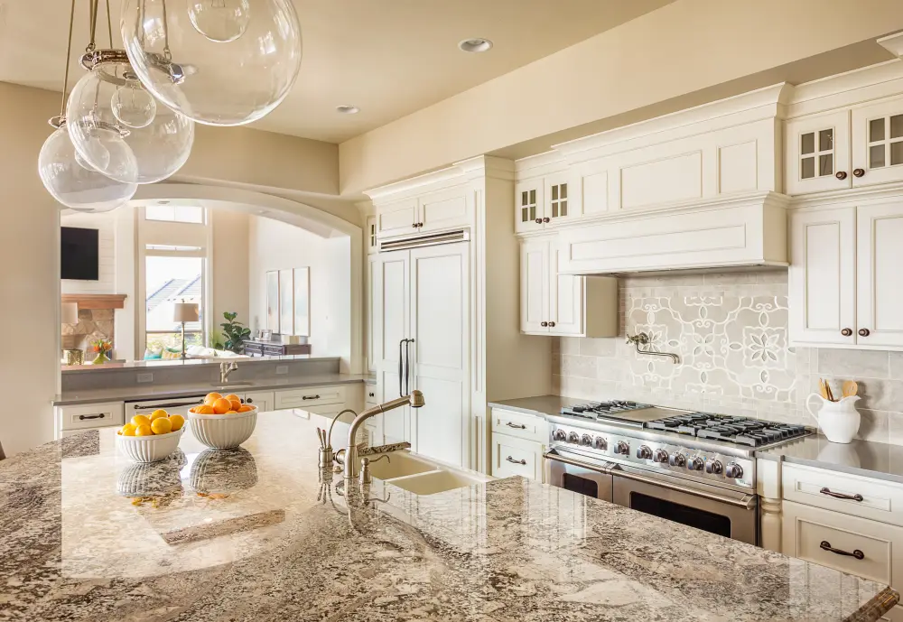 Kitchen with custom stone countertops and island